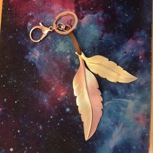 Anthropologie gold and rose gold feather key chain
